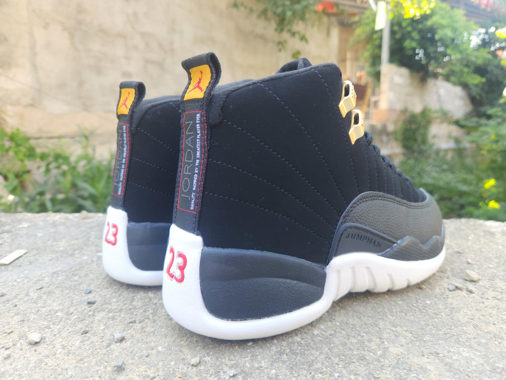 Air Jordan 12 Retro Black & White Sneakers with Gold Accents