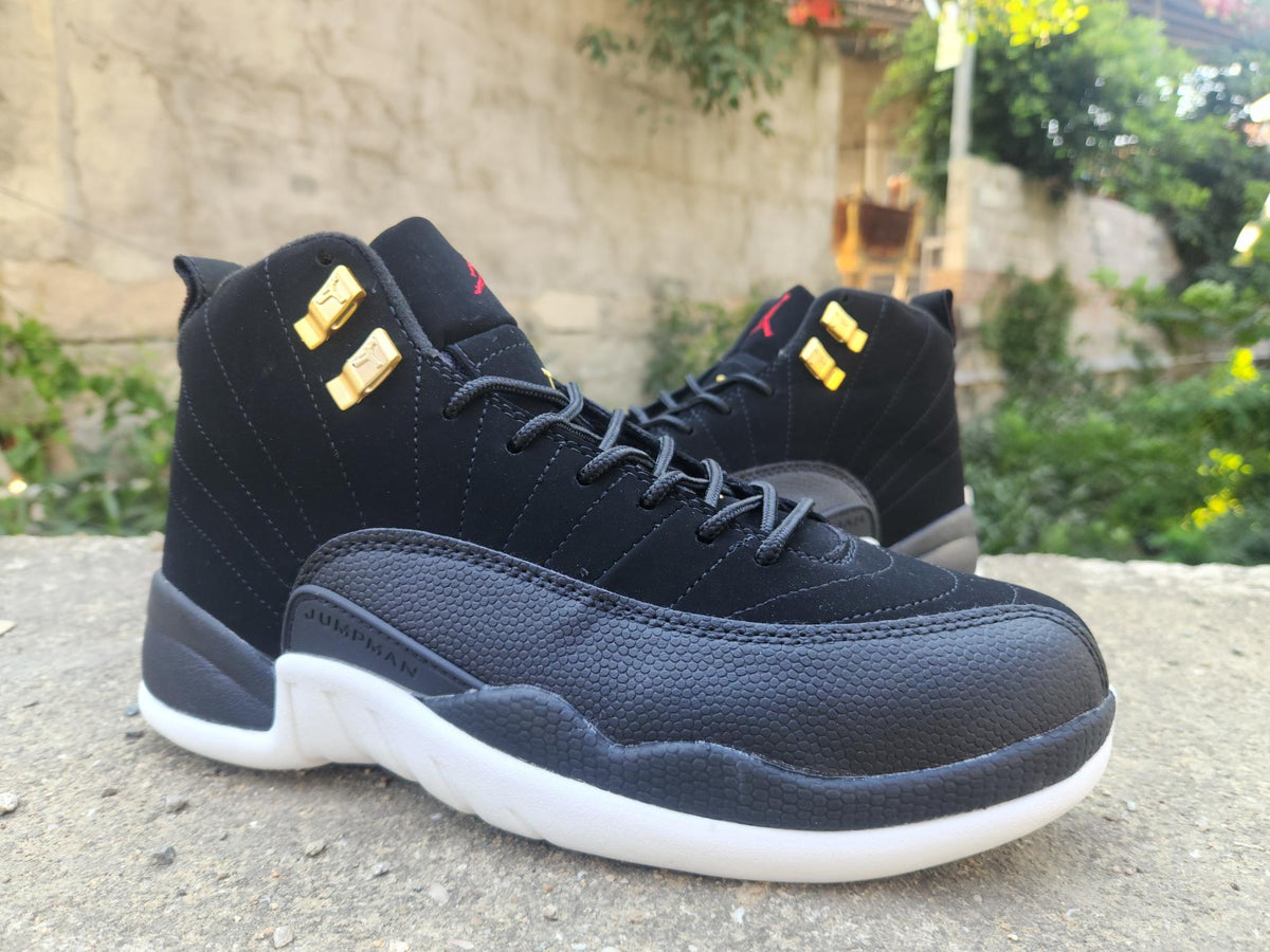 Air Jordan 12 Retro Black & White Sneakers with Gold Accents