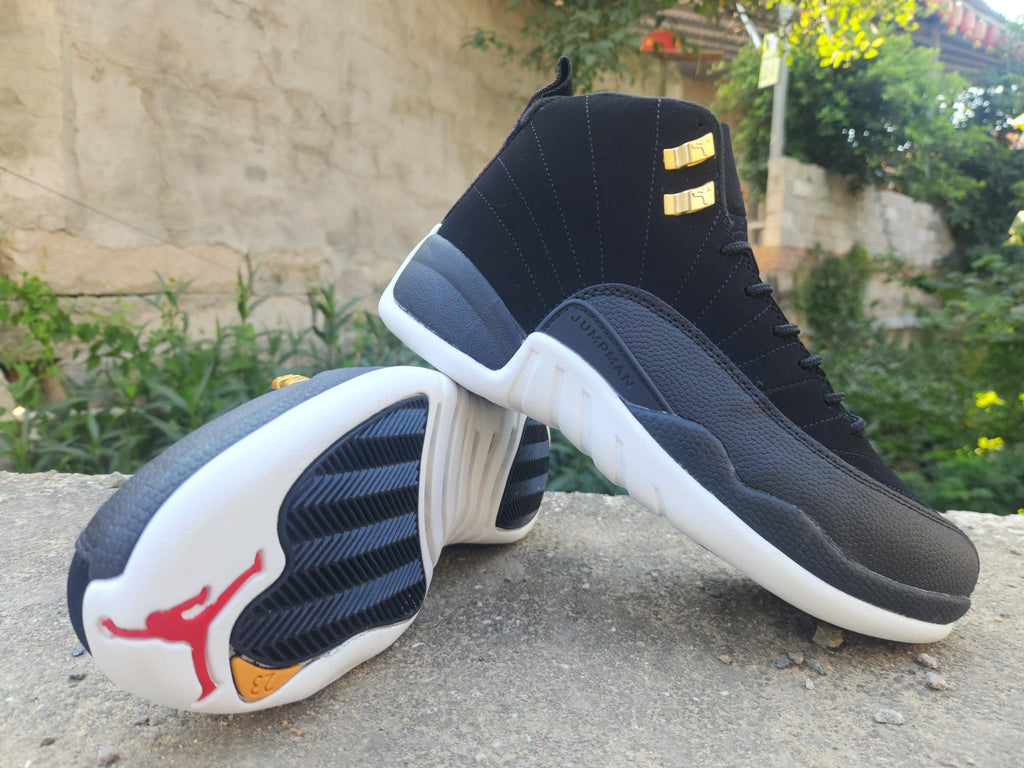Air Jordan 12 Retro Black & White Sneakers with Gold Accents