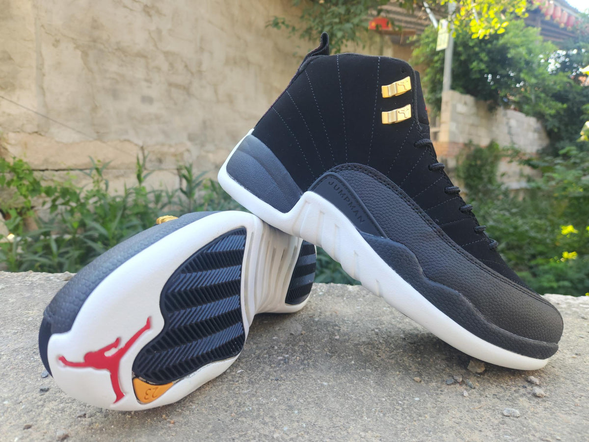 Air Jordan 12 Retro Black & White Sneakers with Gold Accents